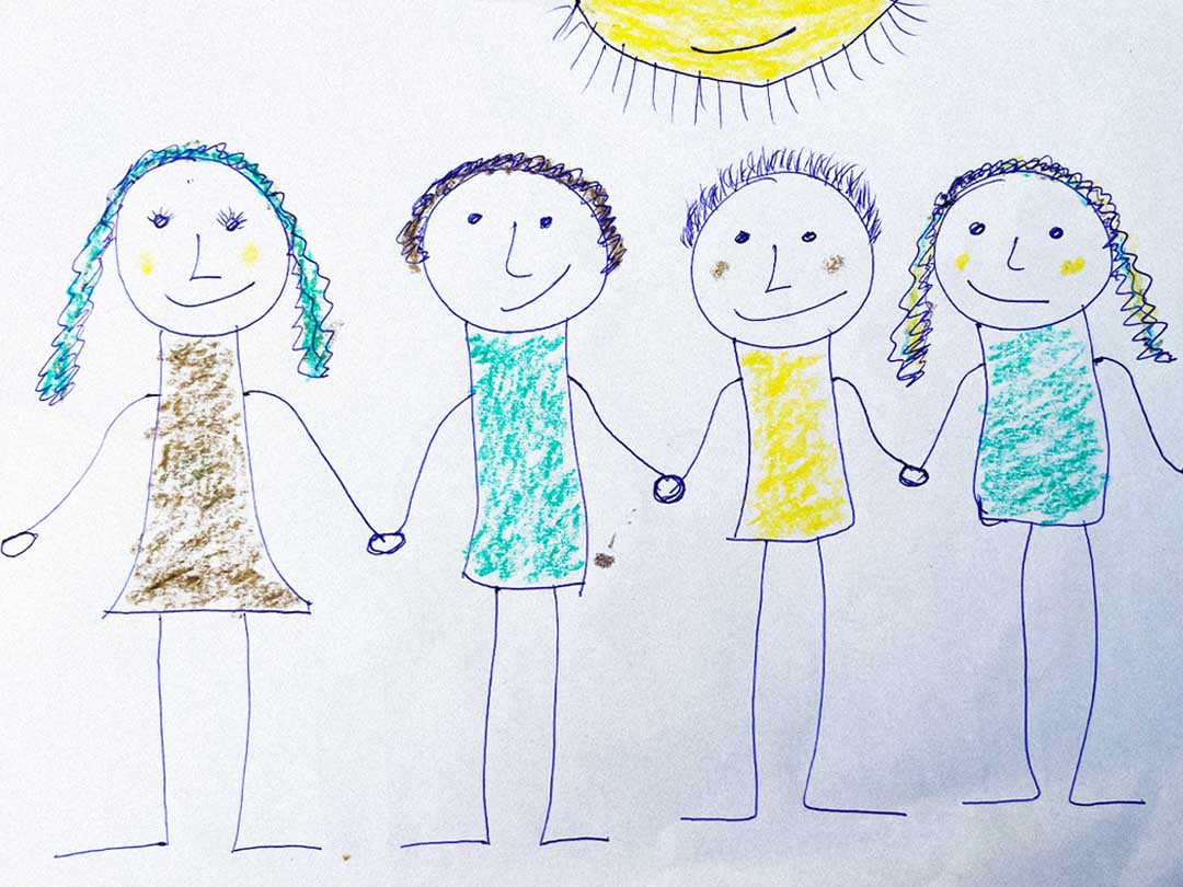 A drawing of four figures holding hands beneath a sun.
